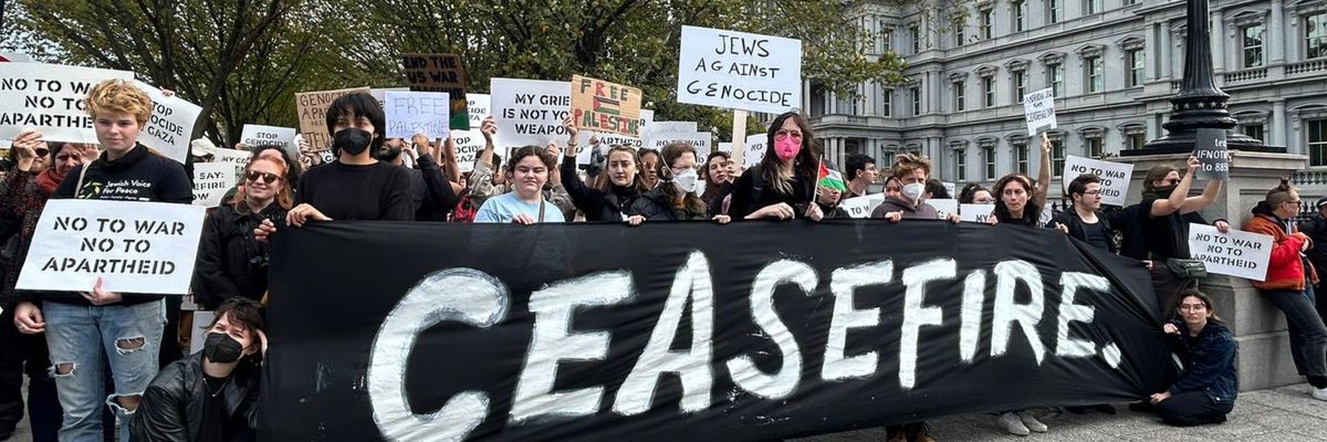 Jewish-led peace activists hold a "ceasefire" banner outside the White House.