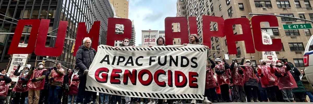 Jewish protesters in NYC hold a banner reading, "AIPAC funds genocide" 