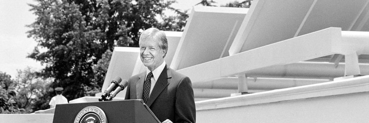 Jimmy Carter speaking in front of Solar Panels on White House