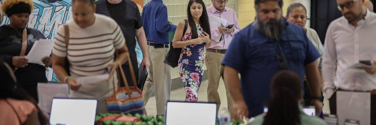 Job seekers attend a career fair