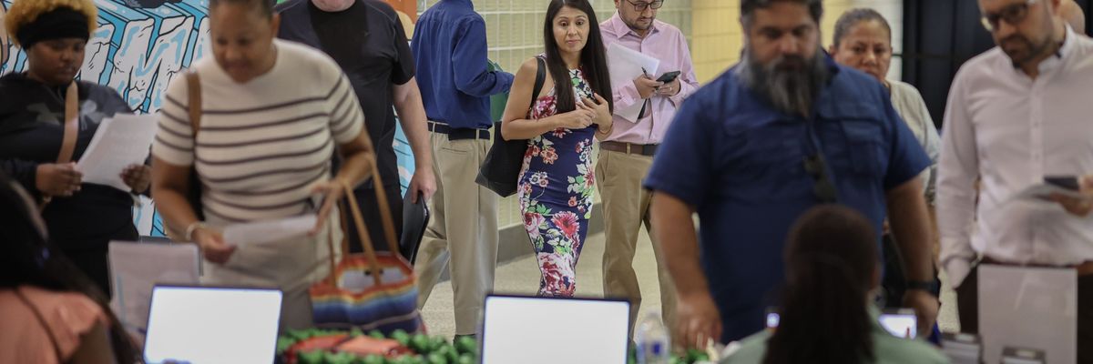 Job seekers attend a career fair