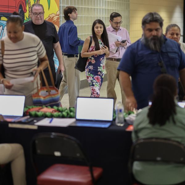 Job seekers attend a career fair