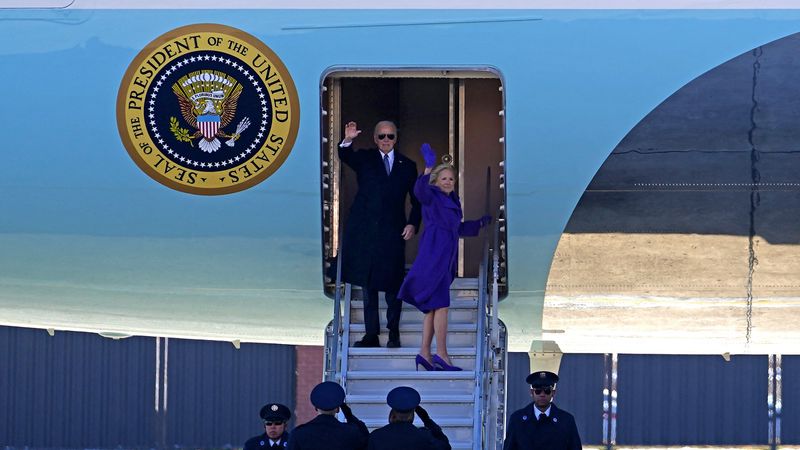 Joe and Jill Biden wave goodbye.