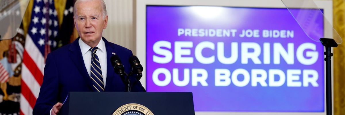 Joe Biden speaks at the presidential podium next to a sign reading "Securing Our Border"
