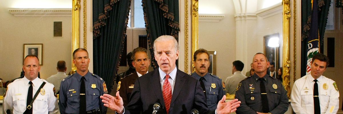 Joe Biden standing with law enforcement officers