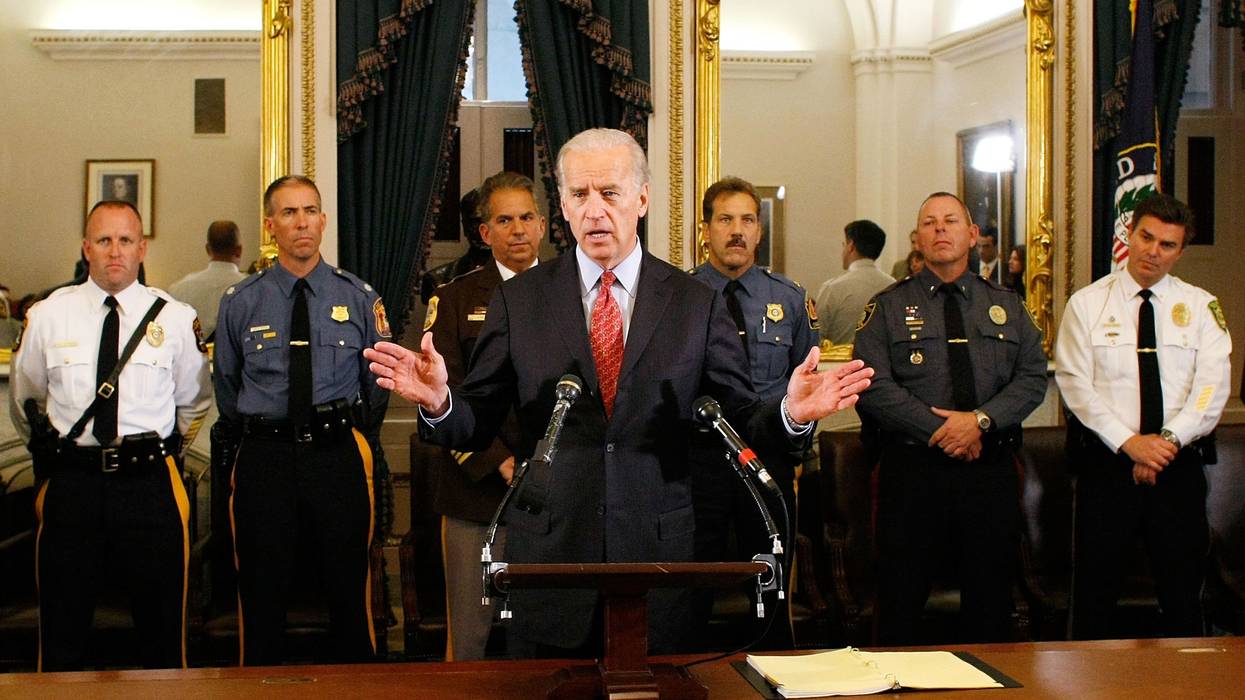 Joe Biden standing with law enforcement officers