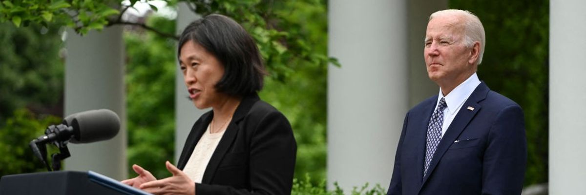 Joe Biden watches and Katherine Tai