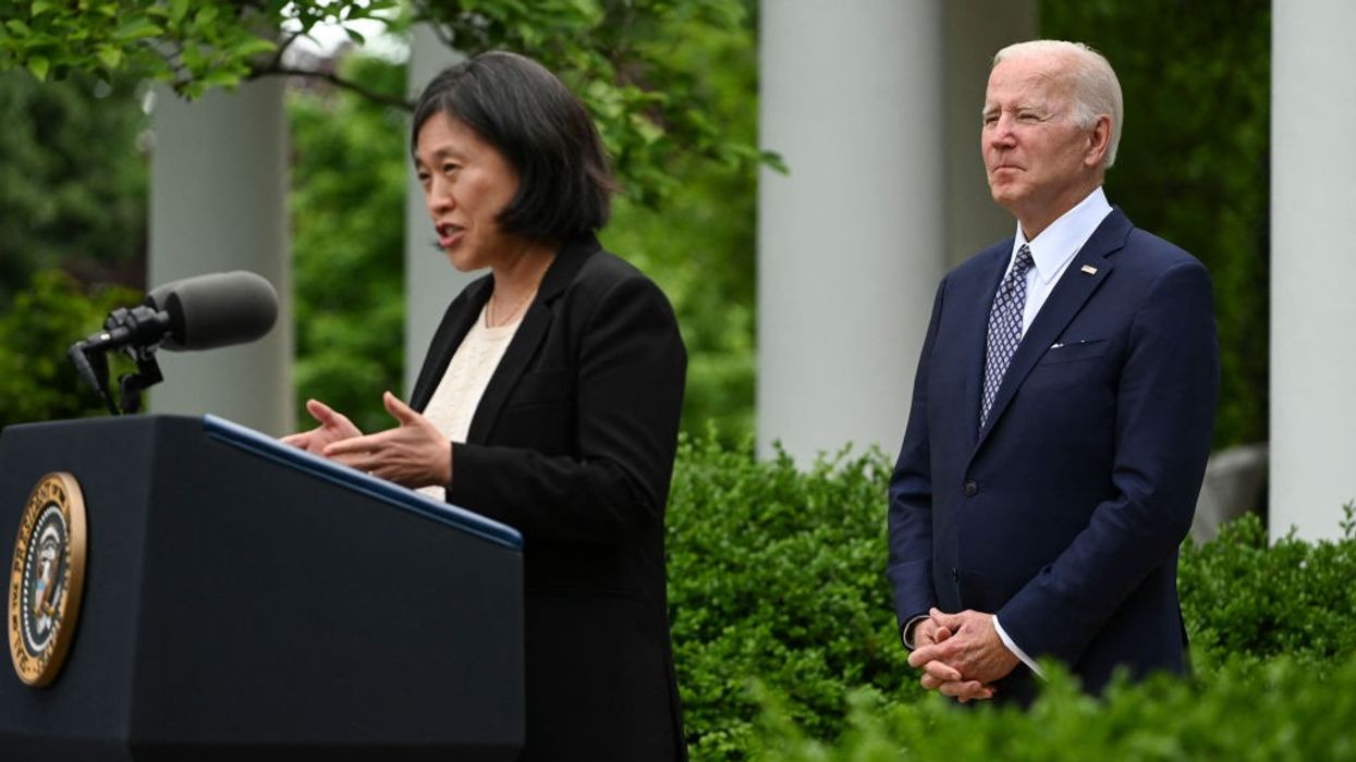 Joe Biden watches and Katherine Tai
