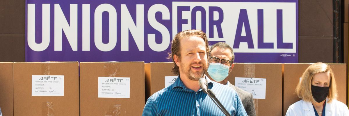 Joe Sanberg speaks at a press conference