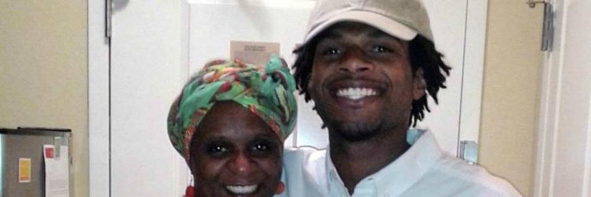 John Crawford III, right, stands with his mother Tressa Sherrod