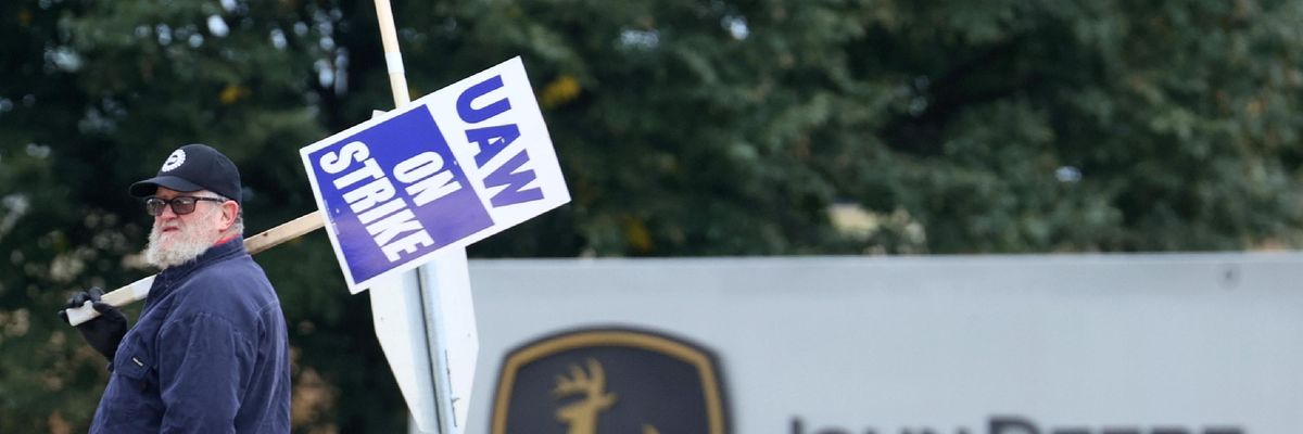 John Deere worker on strike outside an Iowa facility.