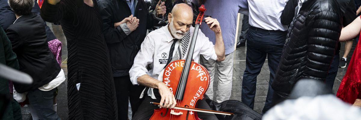 John Mark Rozendaal plays cello outside Citi.