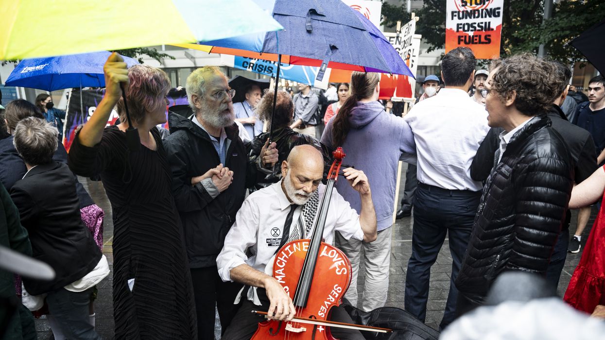 John Mark Rozendaal plays cello outside Citi.