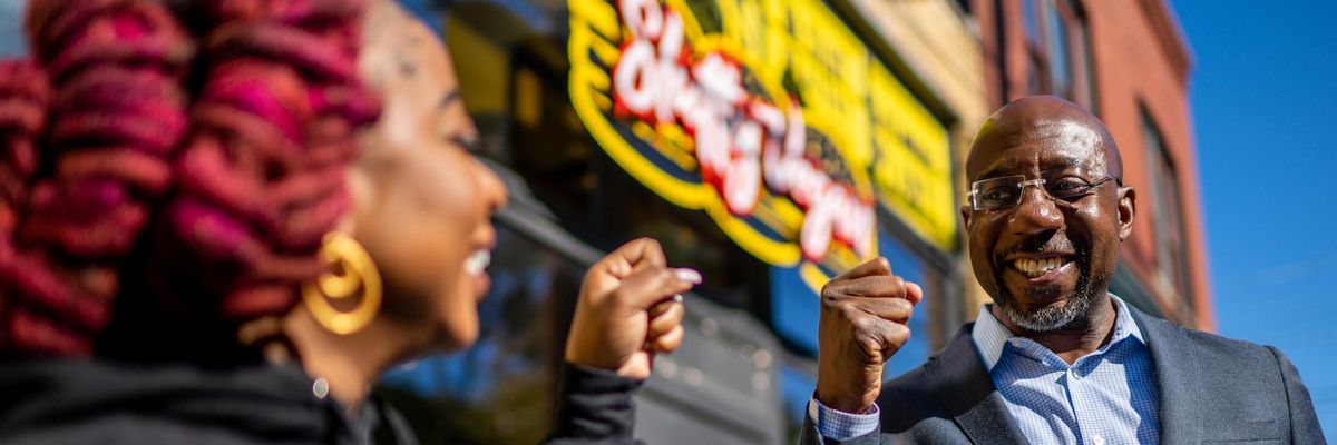 John Warnock with a supporter