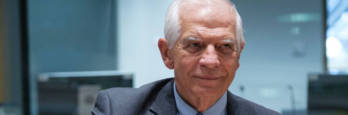 Josep Borrell rings a small bell to open an informal meeting of E.U. foreign ministers in Brussels.