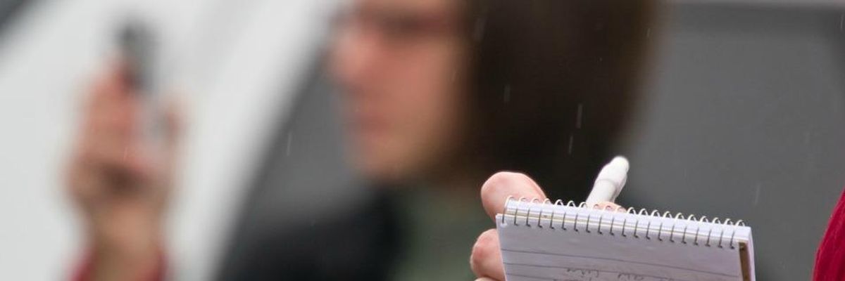 Journalist taking notes