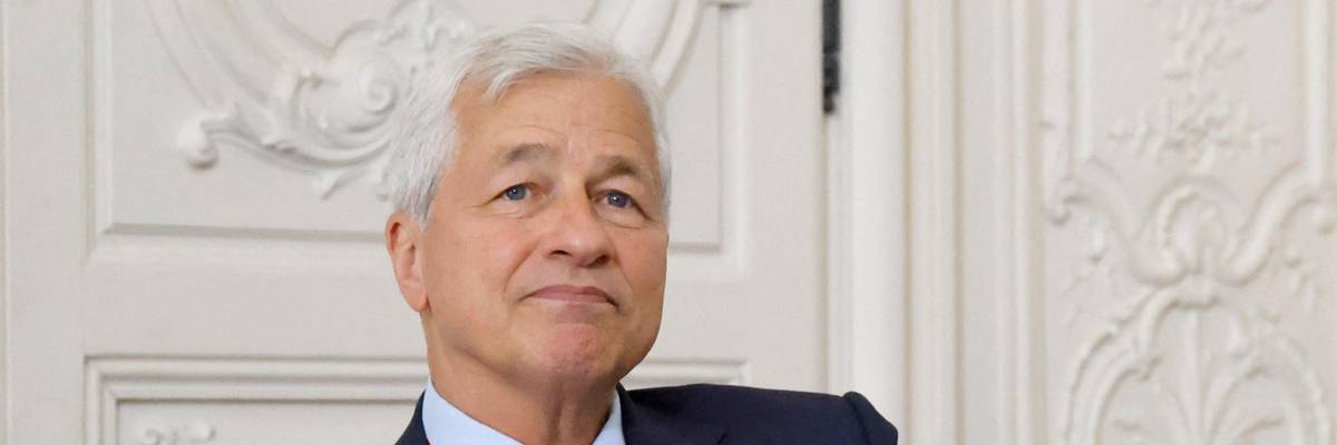 JPMorgan Chase CEO Jamie Dimon looks on during a meeting