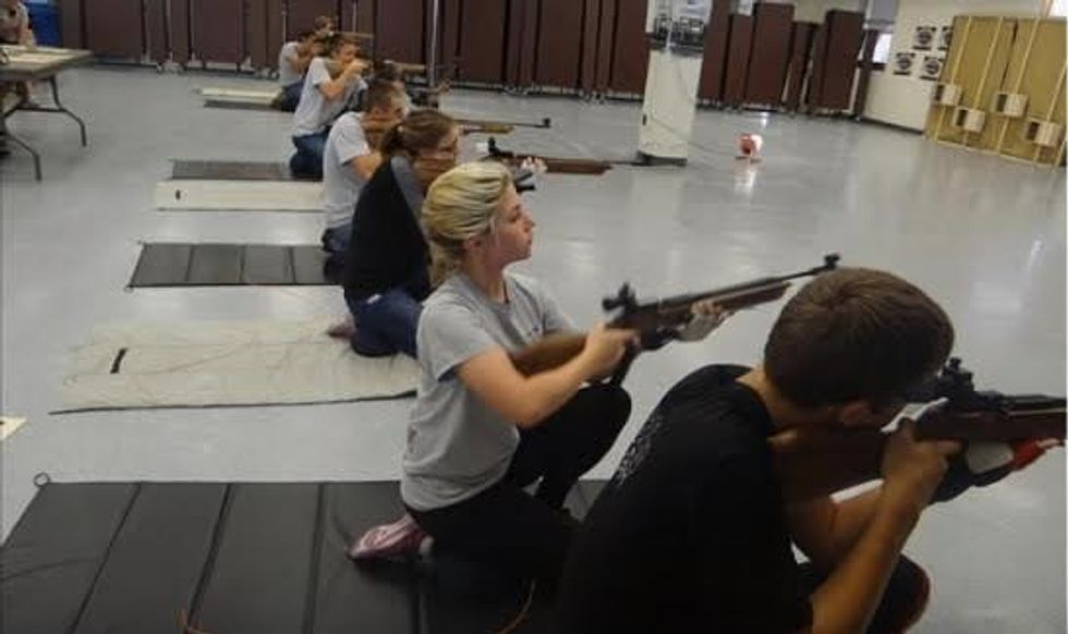 JROTC students at Marjory Stoneman Douglas High school practice firing air rifles in the school's cafeteria. The military classifies these guns as lethal weapons. This image has been removed from the high school's website.