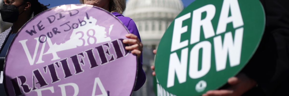 Juli Briskman (2nd R), Algonkian District Supervisor of Loudoun County in Virginia, and Shannon Fisher (R) of the National Organization for Women listen during a news conference near the U.S. Capitol on September 28, 2022.