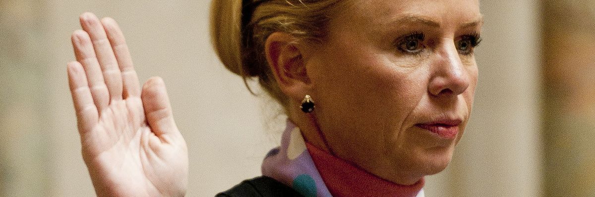 Justice Annette Ziegler leads a swearing-in ceremony