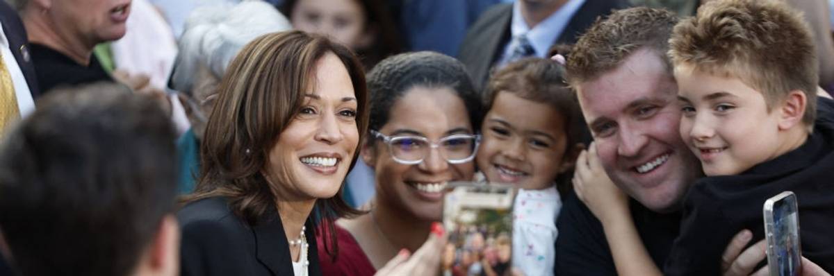 Kamala Harris poses with supporters
