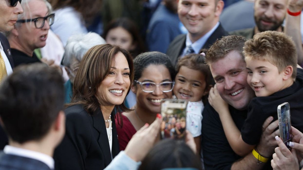 Kamala Harris poses with supporters