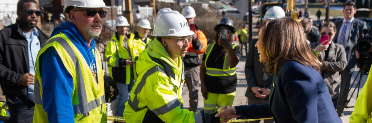 Kamala Harris shakes hands with a unionized worker