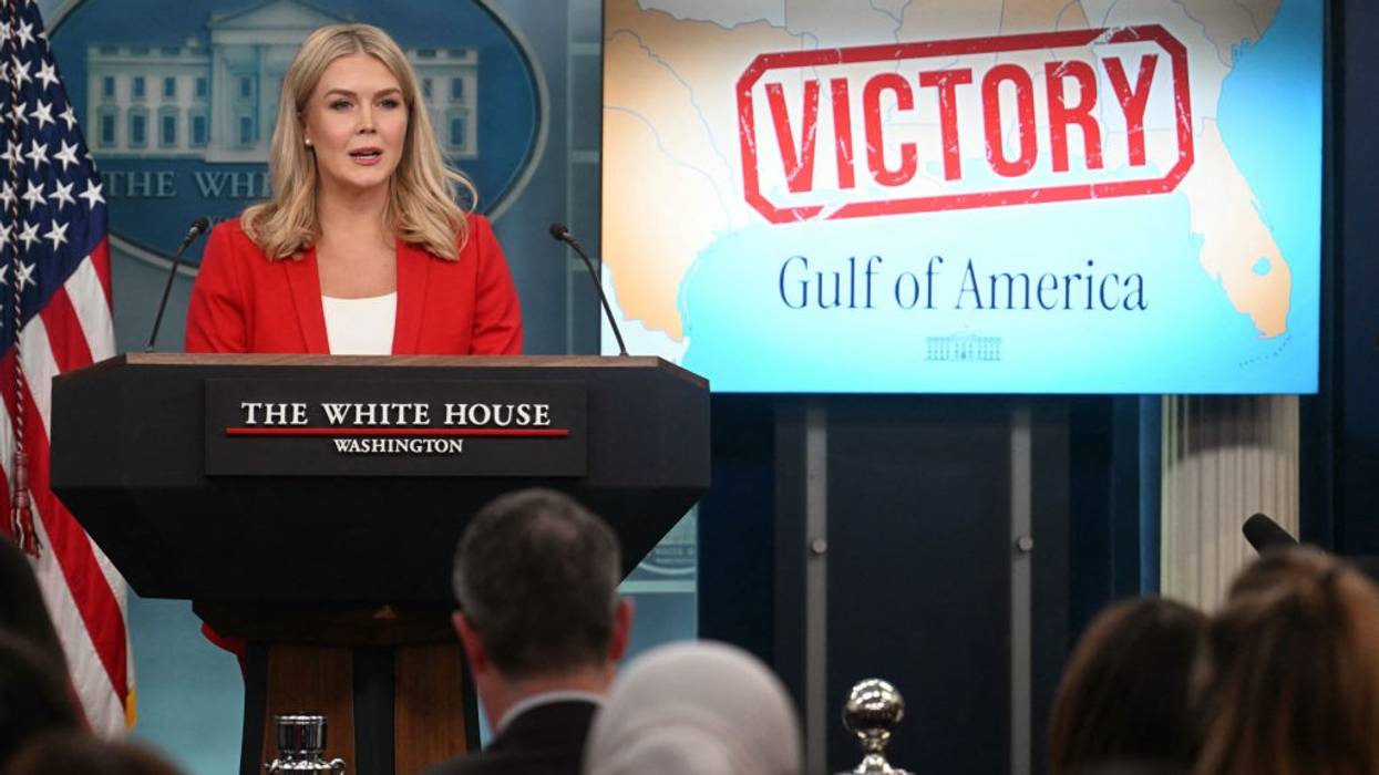 Karoline Leavitt in briefing with "Gulf of America" sign behind her.