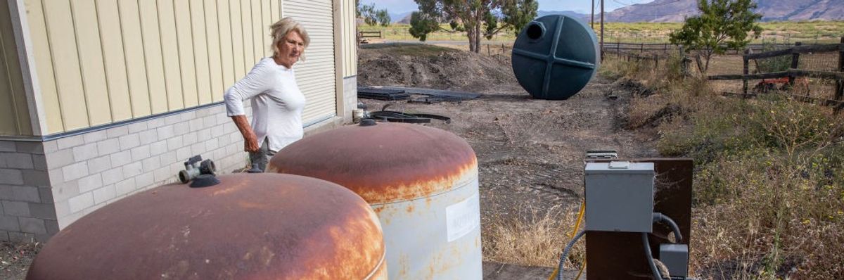 Kathy Borland looks over the well on her property in San Luis Obispo