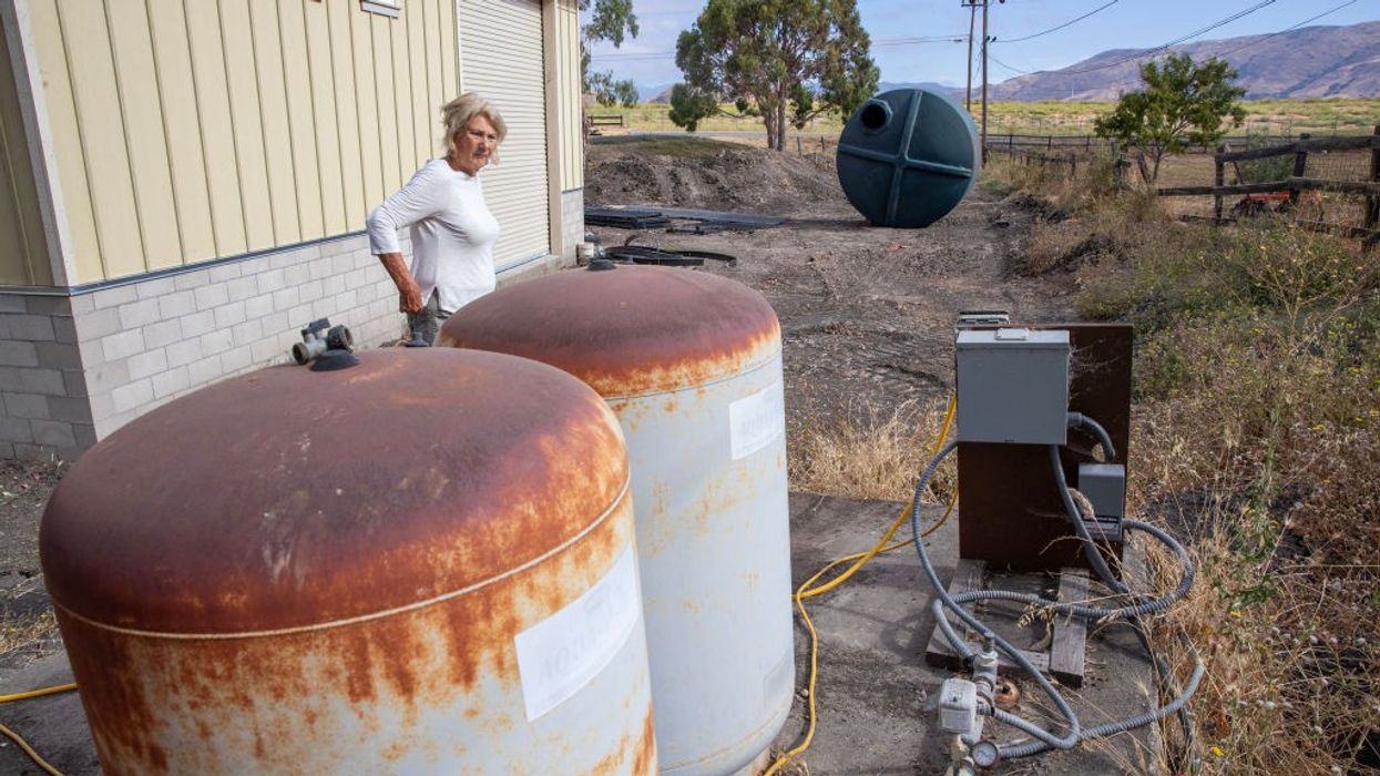 Kathy Borland looks over the well on her property in San Luis Obispo