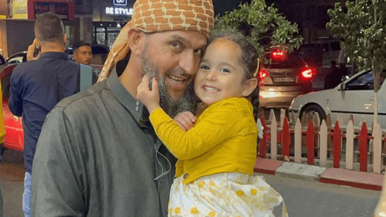 Khaled Nabhan holds his granddaughter Reem