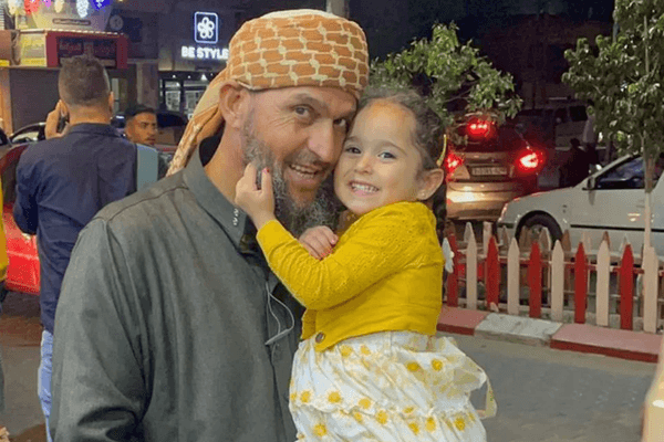 Khaled Nabhan holds his granddaughter Reem