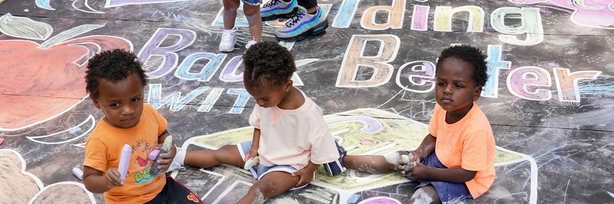 Kids draw at a playground in Washington, D.C.
