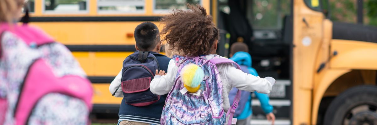 Kids getting onto the school bus