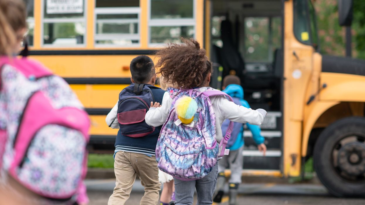 Kids getting onto the school bus