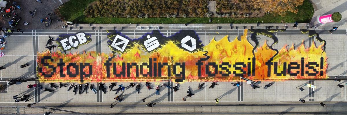 Koala Kollektiv activists taking action outside the European Central Bank in Frankfurt, Germany calling for the central bank to stop funding fossil fuels and climate chaos.