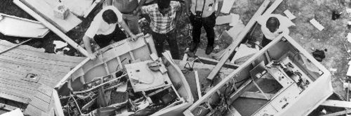KPFT staffers inspect the remains of the station's transmitter after it was bombed in the early 1970s.