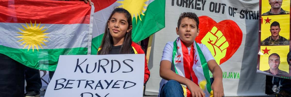 Kurdish children at a protest against Donald Trump.