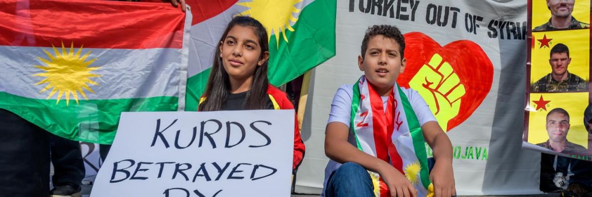 Kurdish children at a protest against Donald Trump.