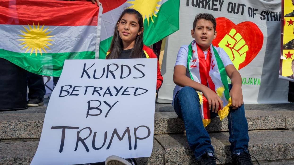 Kurdish children at a protest against Donald Trump.
