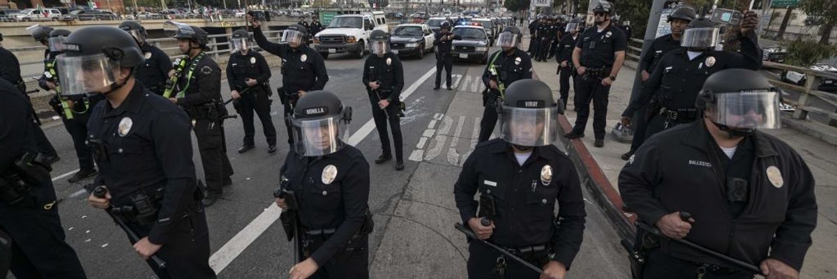 LA Police Officers with batons drawn