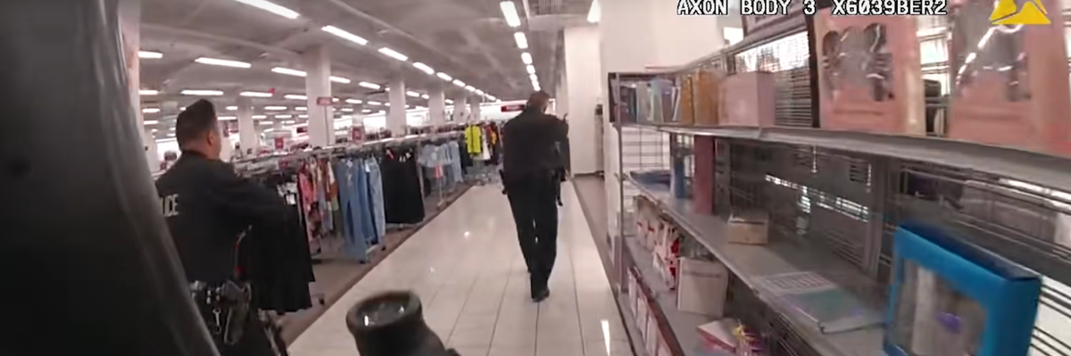 LAPD officer carrying a rifle