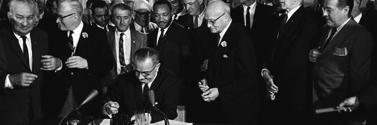 LBJ signs Voting Rights Act