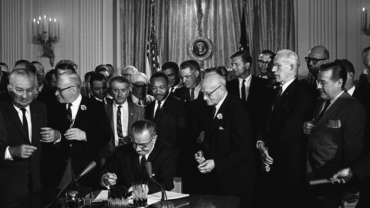 LBJ signs Voting Rights Act