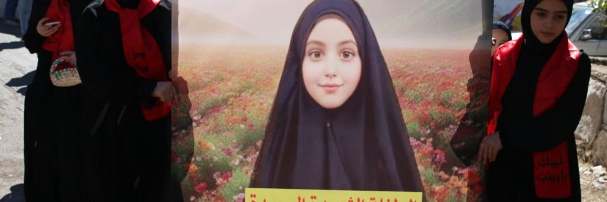 Lebanese women mourn the death of 9-year-old Fatima Abdullah