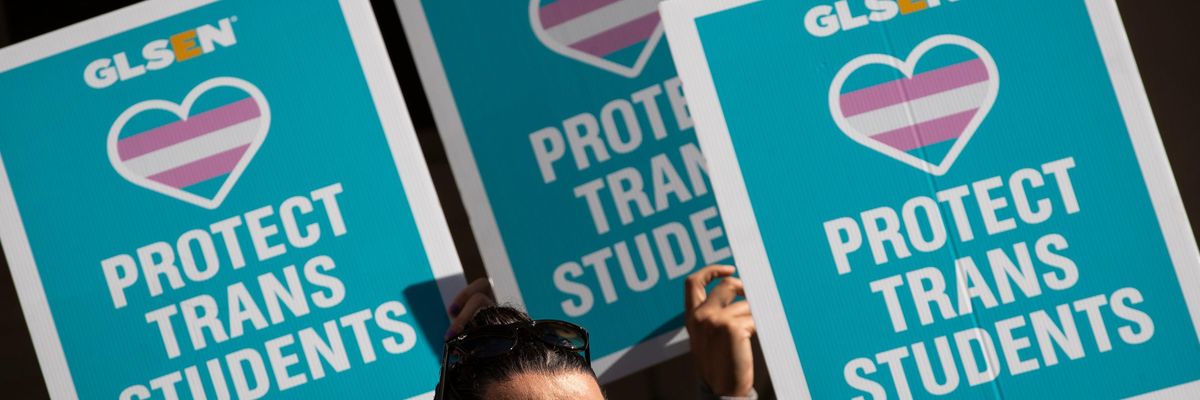LGBTQ activists and their supporters rally in support of transgender people