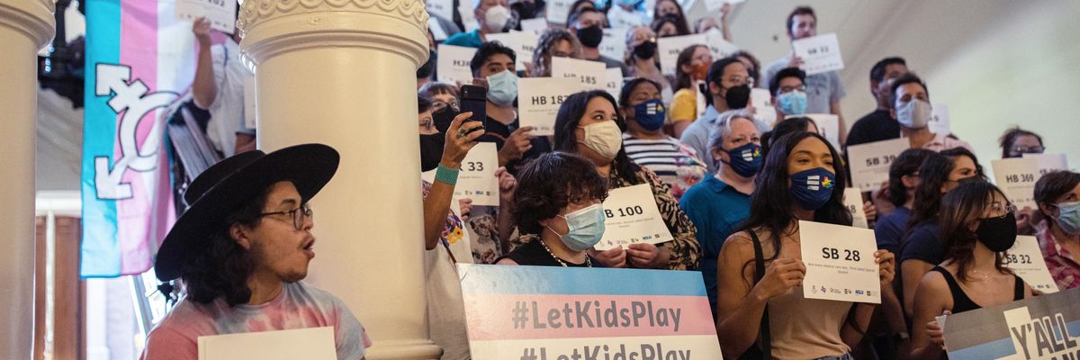 LGBTQ+ rights supporters gather at the Texas State Capitol to protest state Republican-led efforts to pass legislation that would restrict the participation of transgender student athletes on the first day of the 87th Legislature's third special session on September 20, 2021 in Austin, Texas.