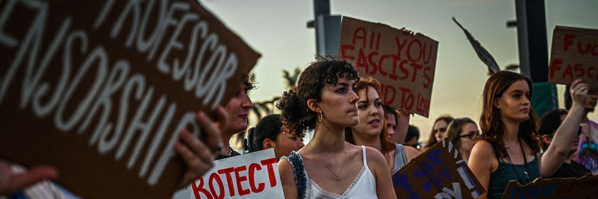 LGBTQ+ rights supporters protest against Republican Florida Gov. Ron DeSantis outside campaign event at the Alico Arena in Fort Myers ahead of the midterm elections on November 6, 2022. 