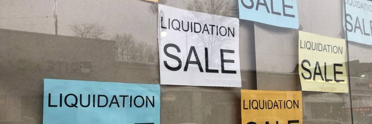 Liquidation Sale signs in business storefront, Queens, New York