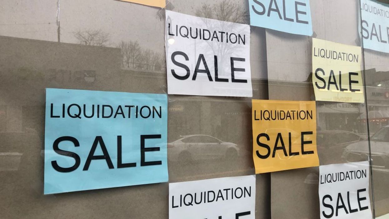 Liquidation Sale signs in business storefront, Queens, New York